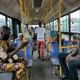 Bus passengers practice social distancing on the first day of lockdown measures being eased in Lagos. May 4.